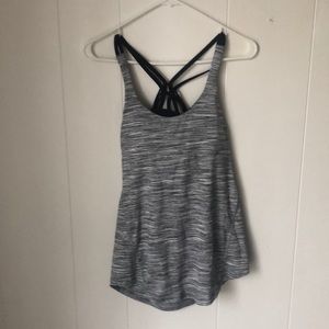Lululemon size 4 tank heather grey with criss cross straps on the back